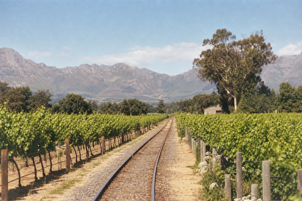 A highway cutting through Winelands scenery toward Paarl, no text, no logos, no people